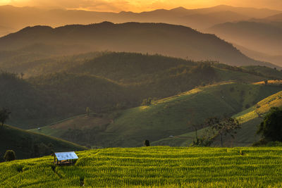 Scenic view of field against mountains