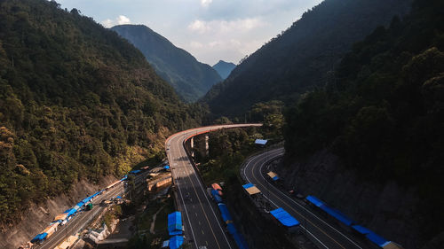 High angle view of highway by mountains