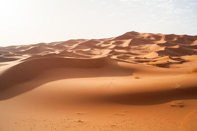 Scenic view of desert against clear sky