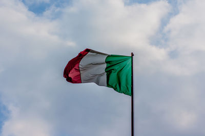 Low angle view of flag against sky