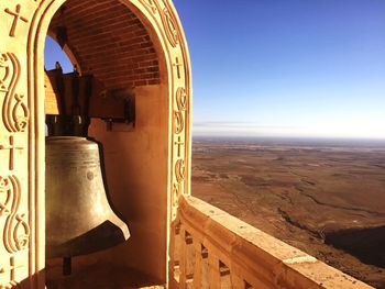 Bell at church against blue sky