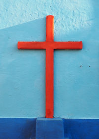 Close-up of cross on wall