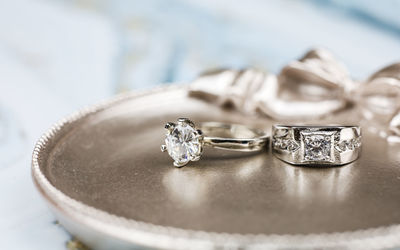 Close-up of wedding rings on table