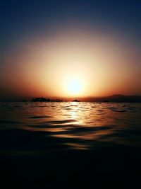 Scenic view of sea against clear sky during sunset