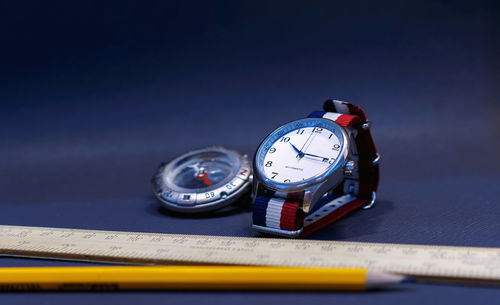 Close-up of clock on table