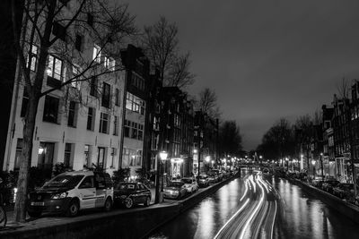 Cars on road in city at night