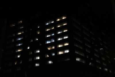 Low angle view of modern building at night