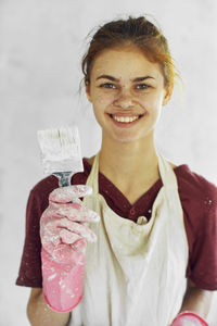 Portrait of young woman drinking glass