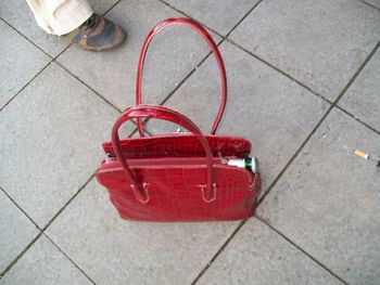 Close-up of red shoes on floor