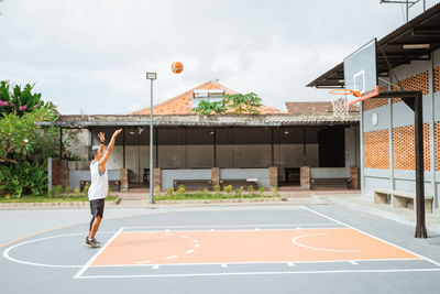 Man playing with ball in background