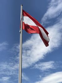 Low angle view of flag against sky