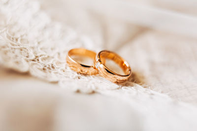 Close-up of wedding rings on table