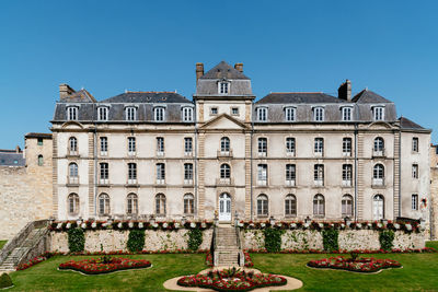 Facade of building against clear blue sky