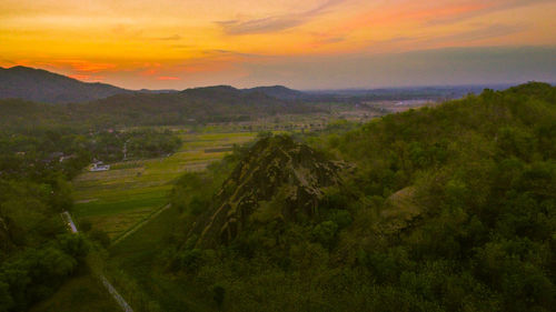 Scenic view of field against sky during sunset