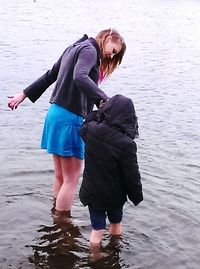 Full length of woman standing on beach