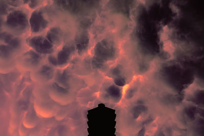 Low angle view of dramatic sky during sunset