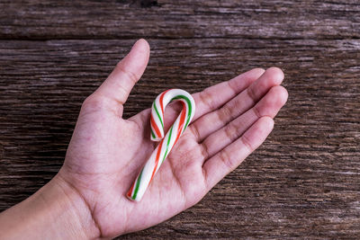 Close-up of hand holding table