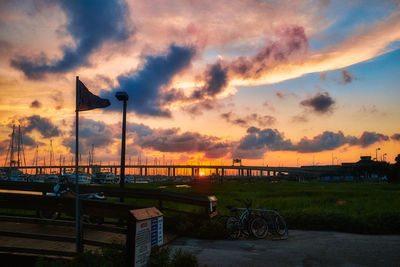 Scenic view of river against sky during sunset