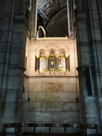 Low angle view of ornate window on building
