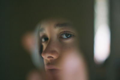 Reflection of young woman on mirror