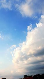 Low angle view of building against cloudy sky