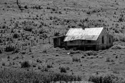 Abandoned built structure on field