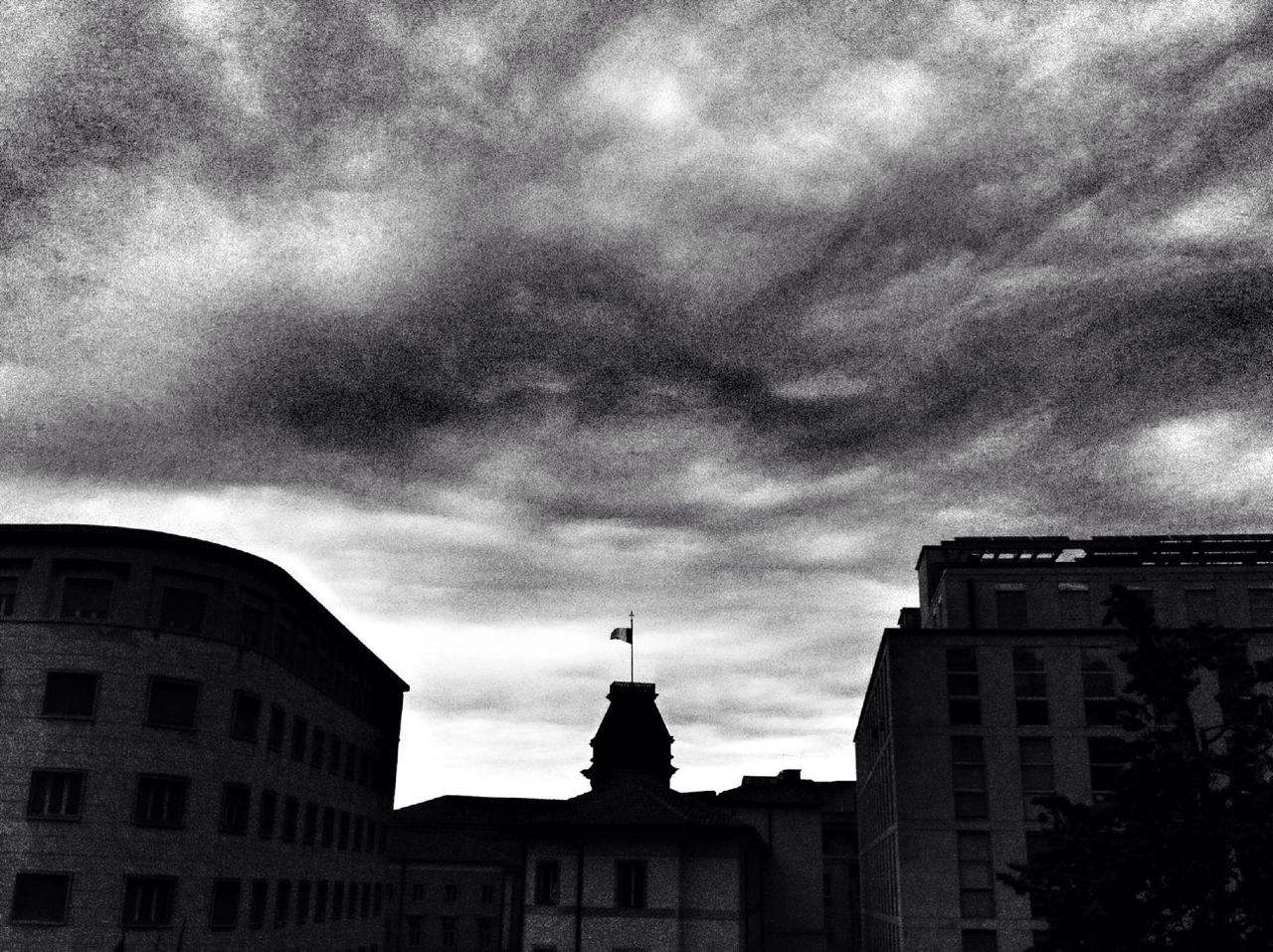 architecture, building exterior, built structure, sky, low angle view, cloud - sky, cloudy, weather, overcast, building, cloud, silhouette, dusk, city, history, statue, outdoors, high section, storm cloud, no people