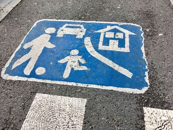 High angle view of arrow sign on road