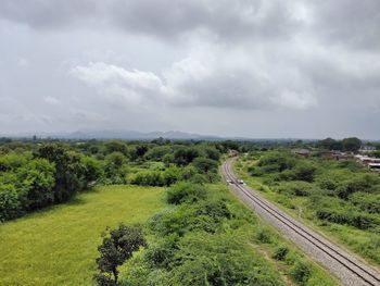 Nature theories- scenic view of landscape with rail tracks against sky