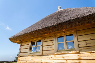 Low angle view of building against clear blue sky