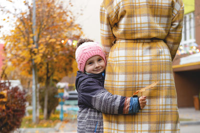 Portrait of boy standing in park