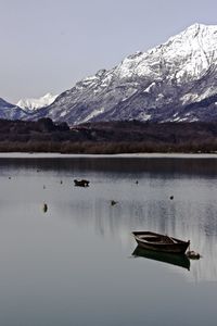 Scenic view of lake with mountains in background