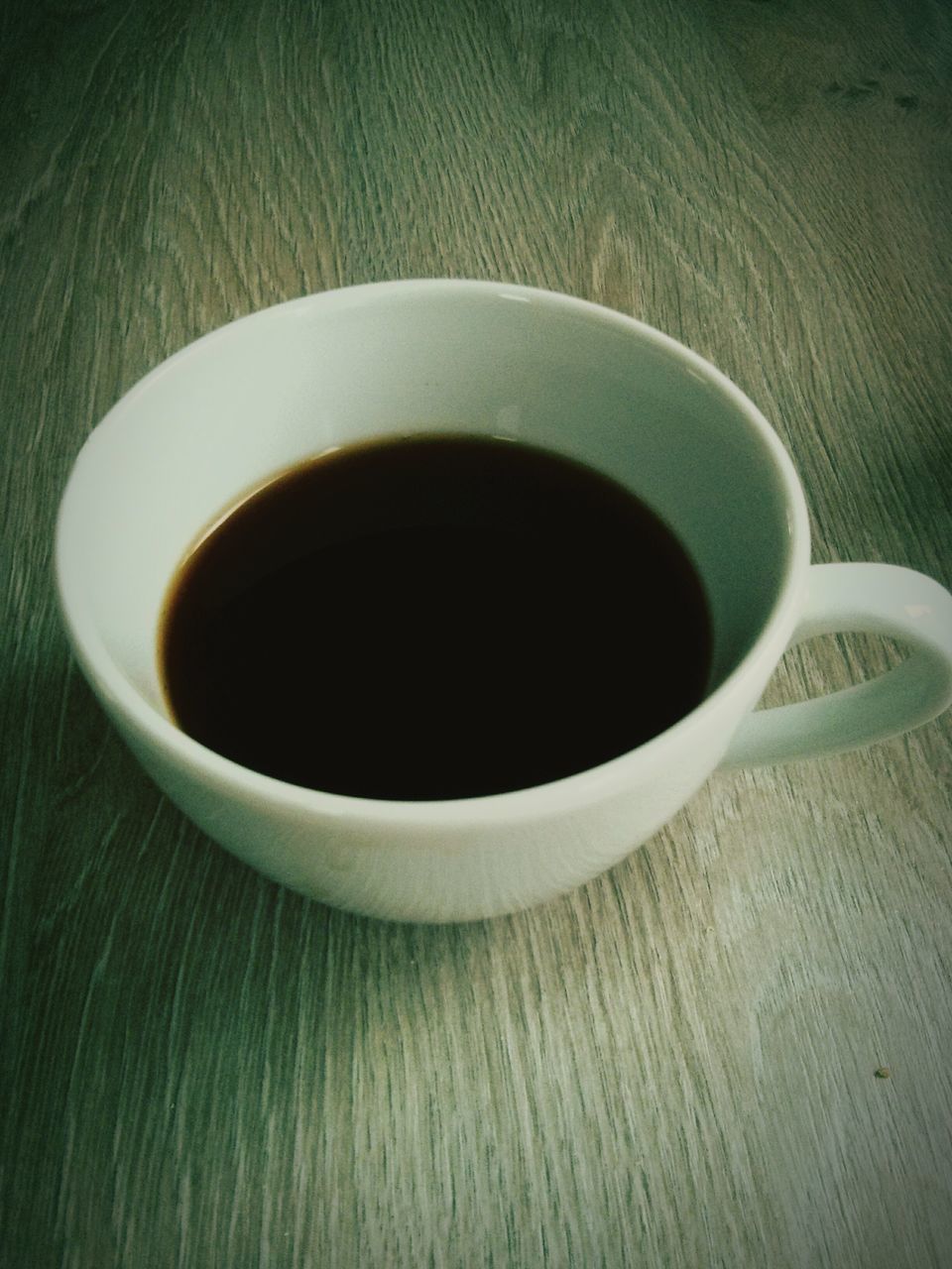 coffee cup, drink, food and drink, refreshment, indoors, coffee - drink, saucer, freshness, cup, table, still life, coffee, high angle view, close-up, directly above, tea cup, tea, white color, no people, spoon