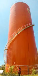 Low angle view of factory against sky