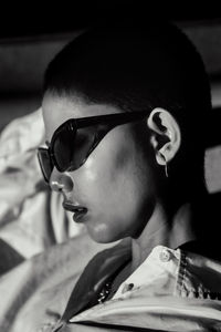 Close-up portrait of young woman wearing eyeglasses