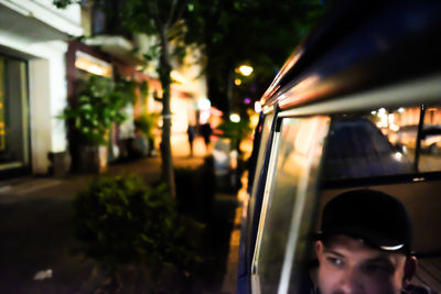 Blurred motion of trees in city at night