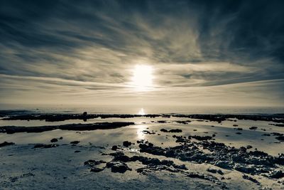 Scenic view of sea against sky at sunset