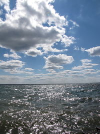 Scenic view of sea against cloudy sky