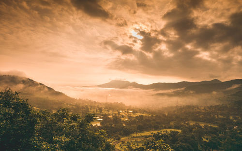 Scenic view of mountains against sky during sunset