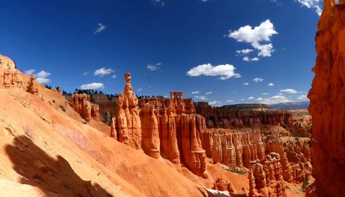 Panoramic view of rock formations against sky