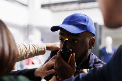 Side view of man using mobile phone