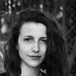 Close-up portrait of smiling young woman