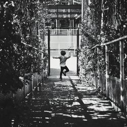 Full length of boy playing on walkway