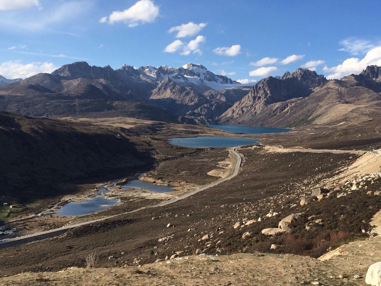 mountain, tranquil scene, tranquility, mountain range, scenics, beauty in nature, sky, water, nature, landscape, lake, non-urban scene, cloud, idyllic, cloud - sky, remote, physical geography, day, geology, outdoors