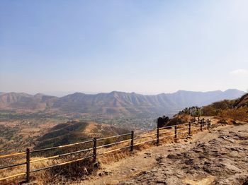 Scenic view of landscape and mountains against sky