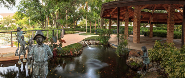 Panoramic view of people standing in water