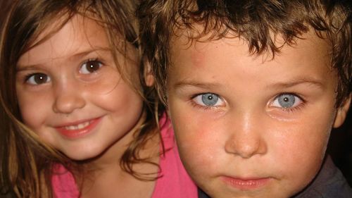 Close-up portrait of siblings