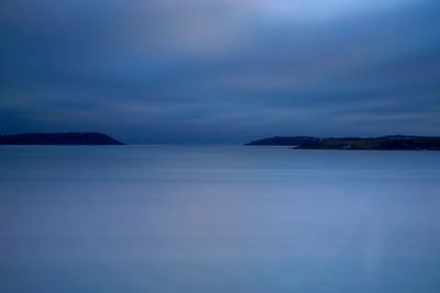 Scenic view of sea against sky at dusk