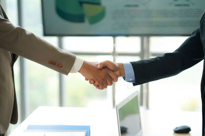 Business colleagues shaking hands