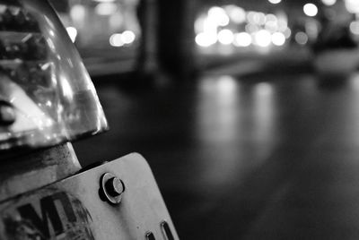 Close-up of illuminated electric lamp on table